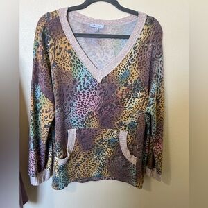 Woman’s Large White Birch multicolored cheetah print V-neck blouse.